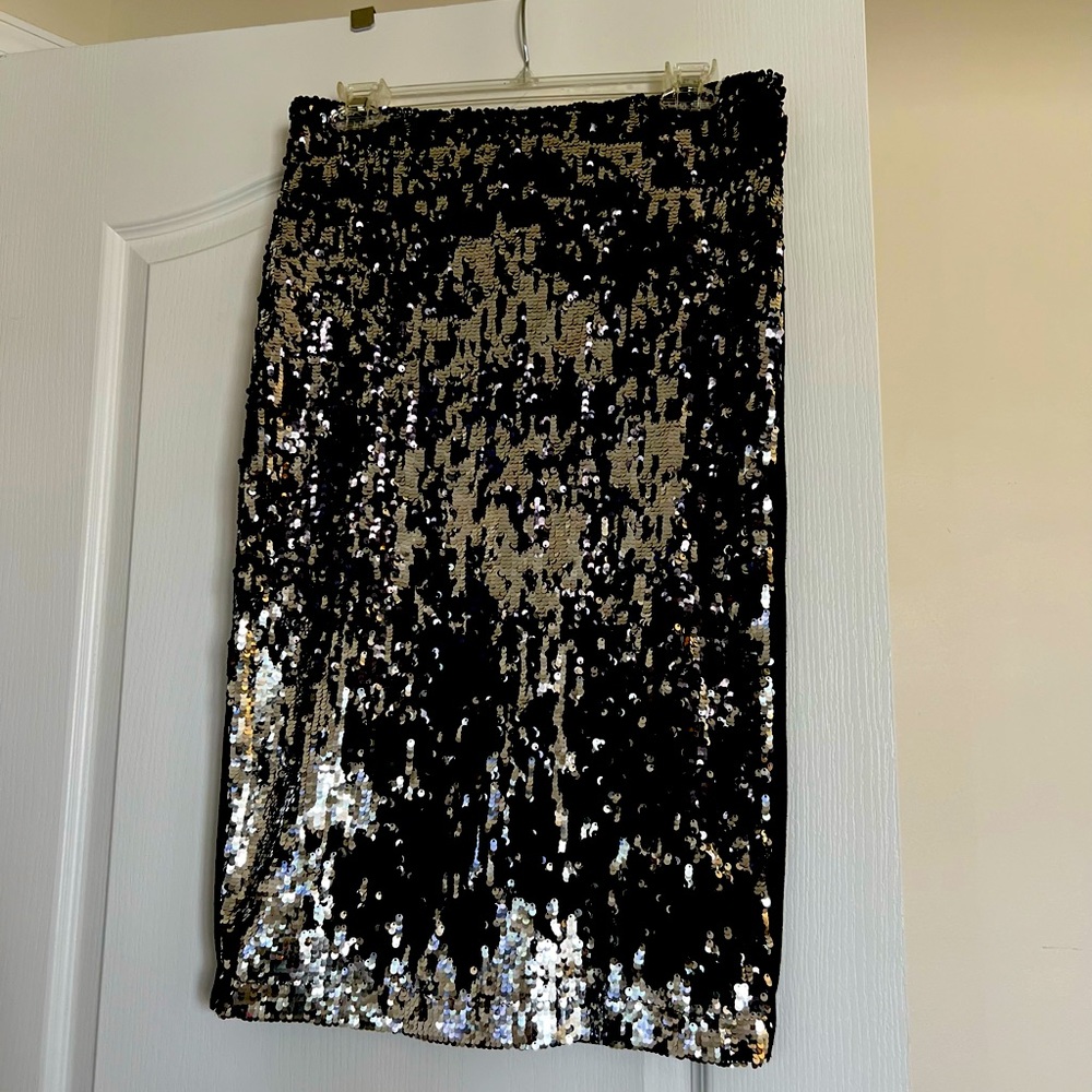 Silver sequin and black ponte knee length skirt. Worn once- lots of stretch